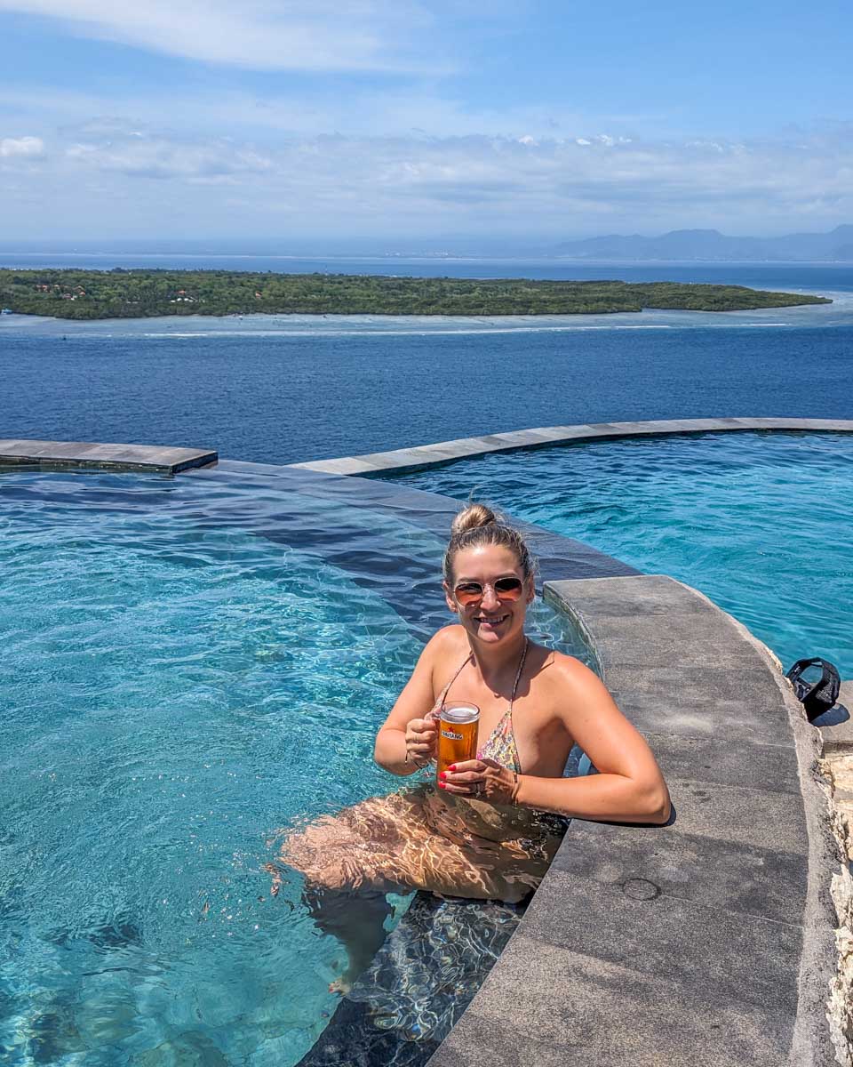 Bailey enjoys a drink at a cliffiside restaurant on tour to Nusa Penida, Bali