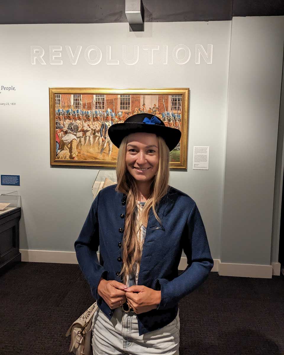Bailey in a historic costume at the museum of the american revolution