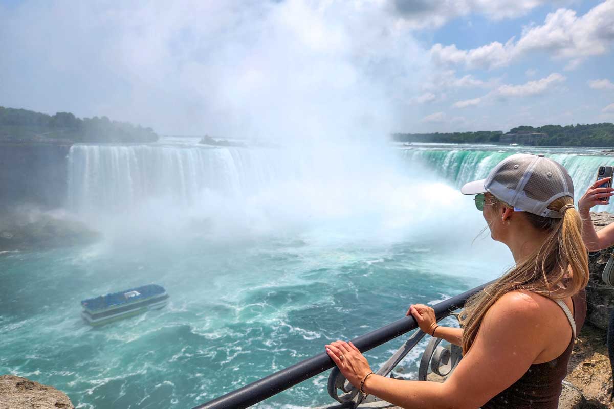 Bailey looking at Niagara falls from the walkway Canada