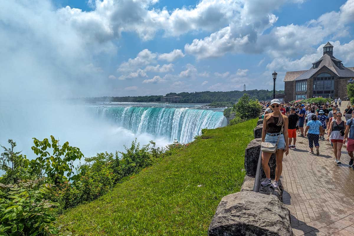 Bailey poses for a photo next to niagara falls canada