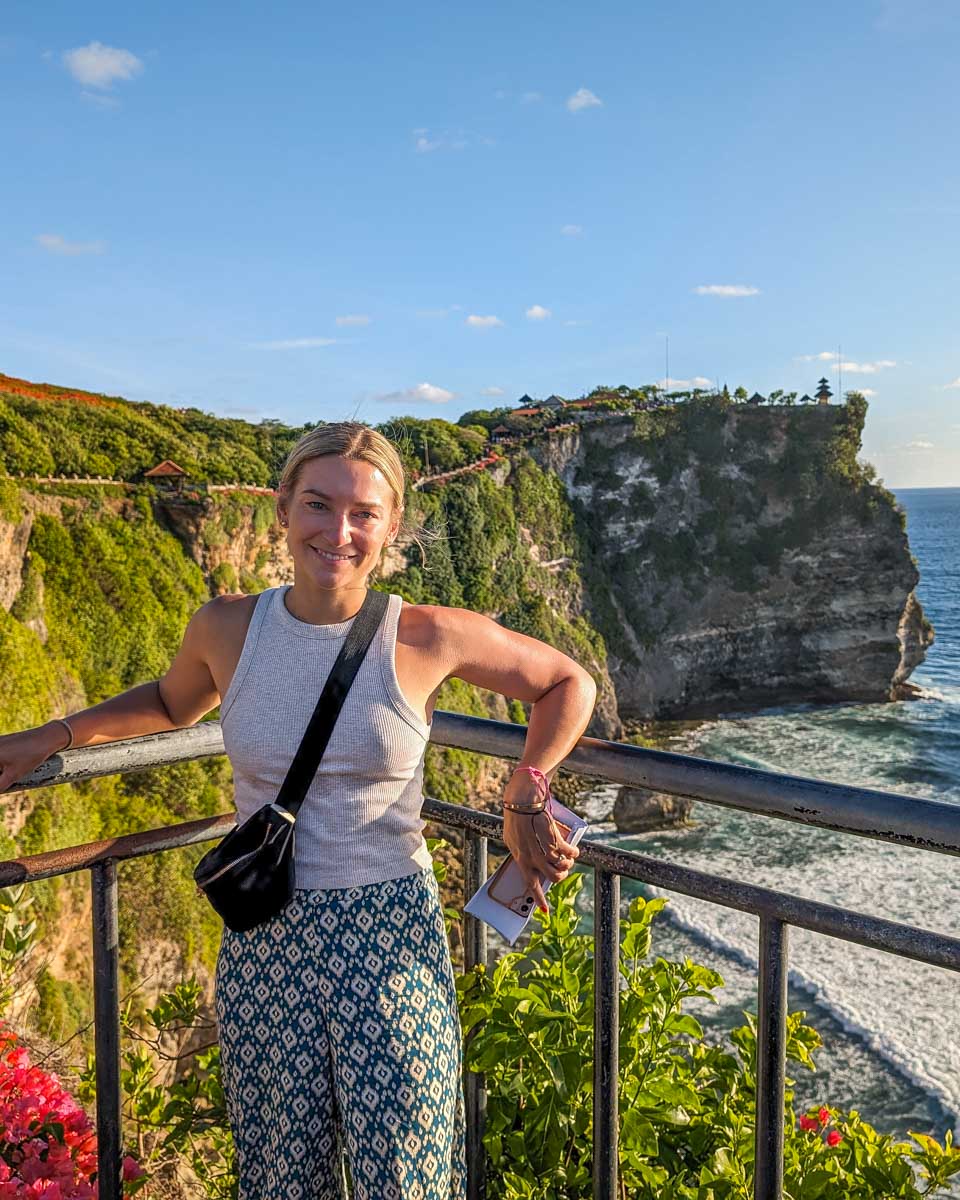 Bailey poses for a photo on the cliffs at Uluwatu temple in Bali