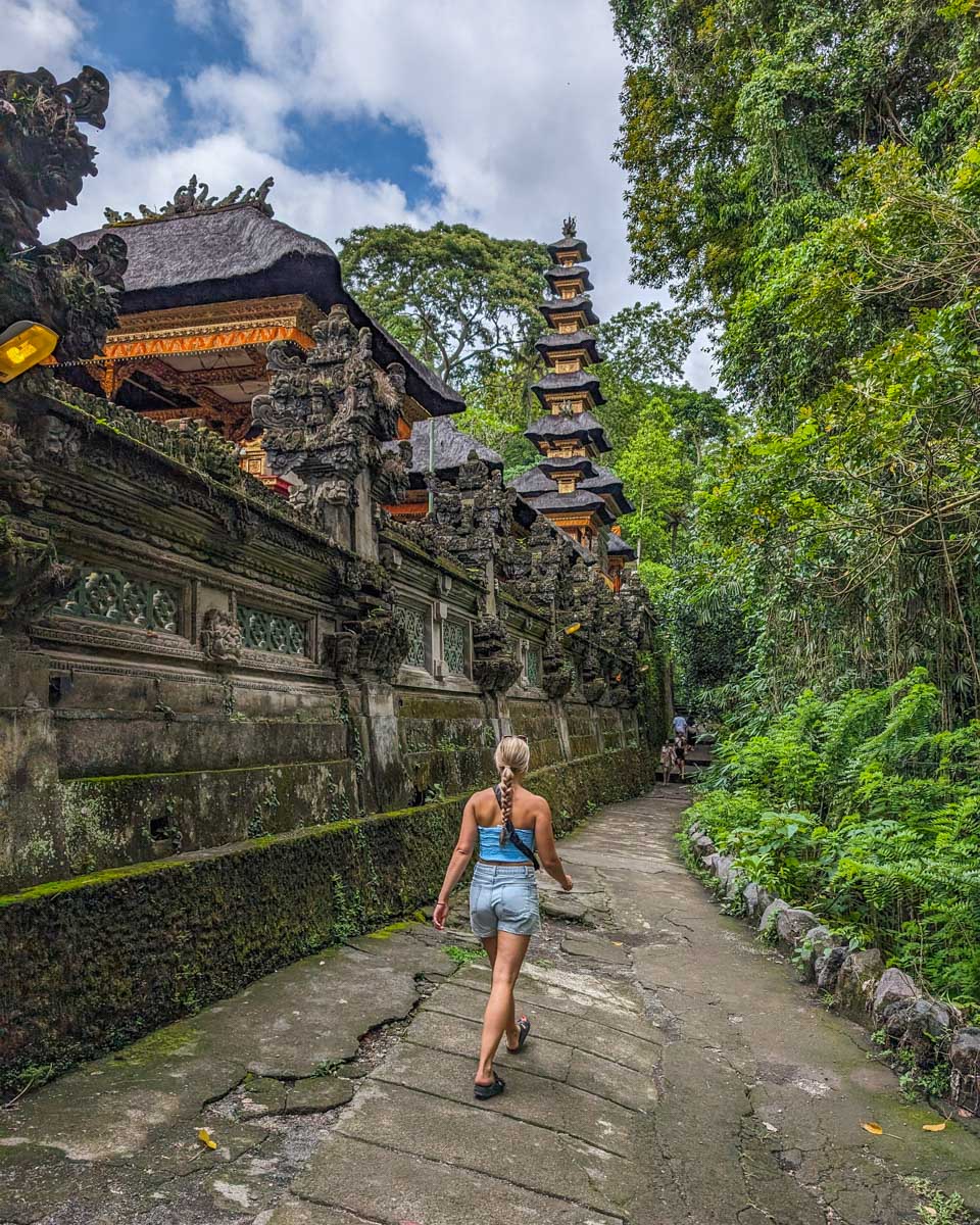 Bailey walks beside temples at the start of the Campuhan Ridge Walk in Bali