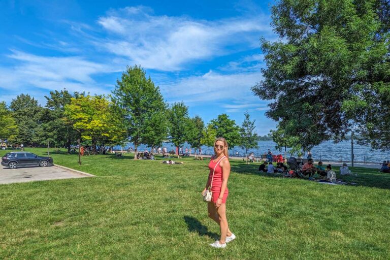 Bailey walks through a park on a summers day in Toronto