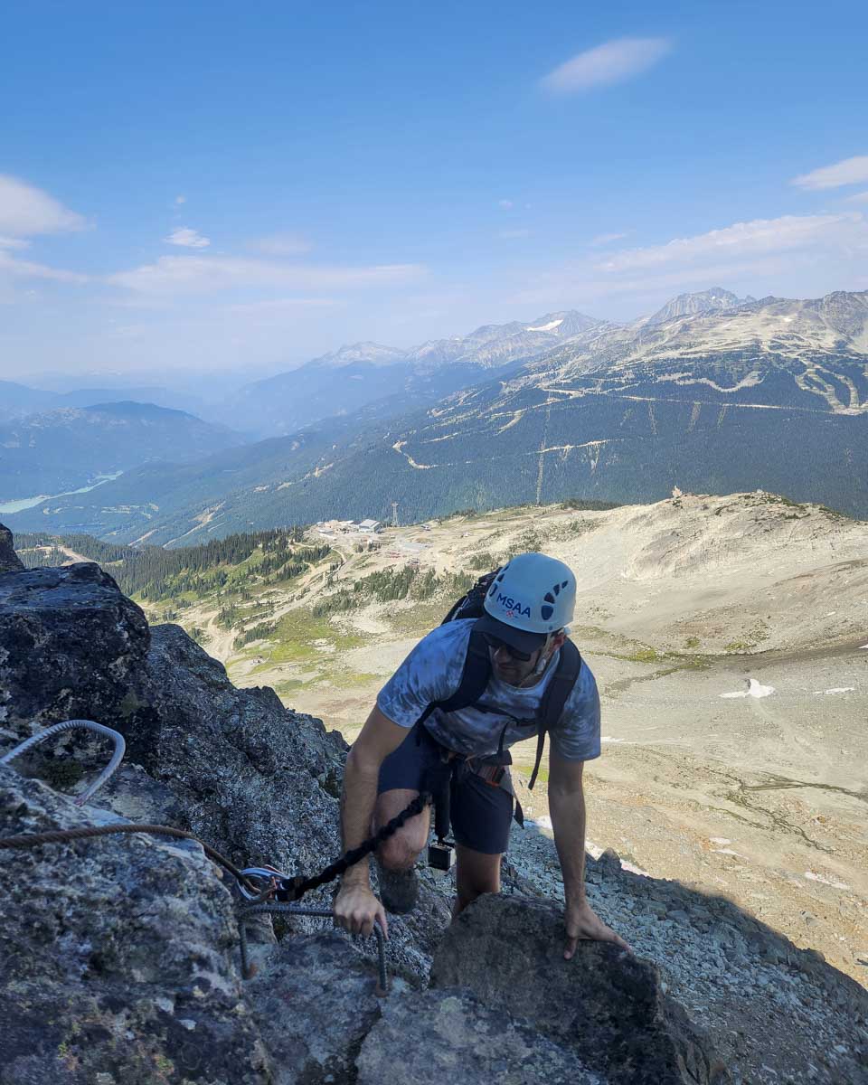 Daniel navigates the rocks during Via Ferrata, Whistler, Canada