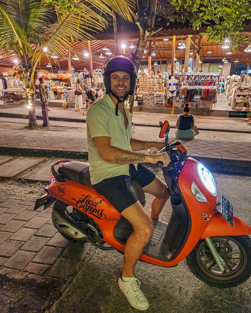 Daniel on a scooter at night in Canggu, Bali