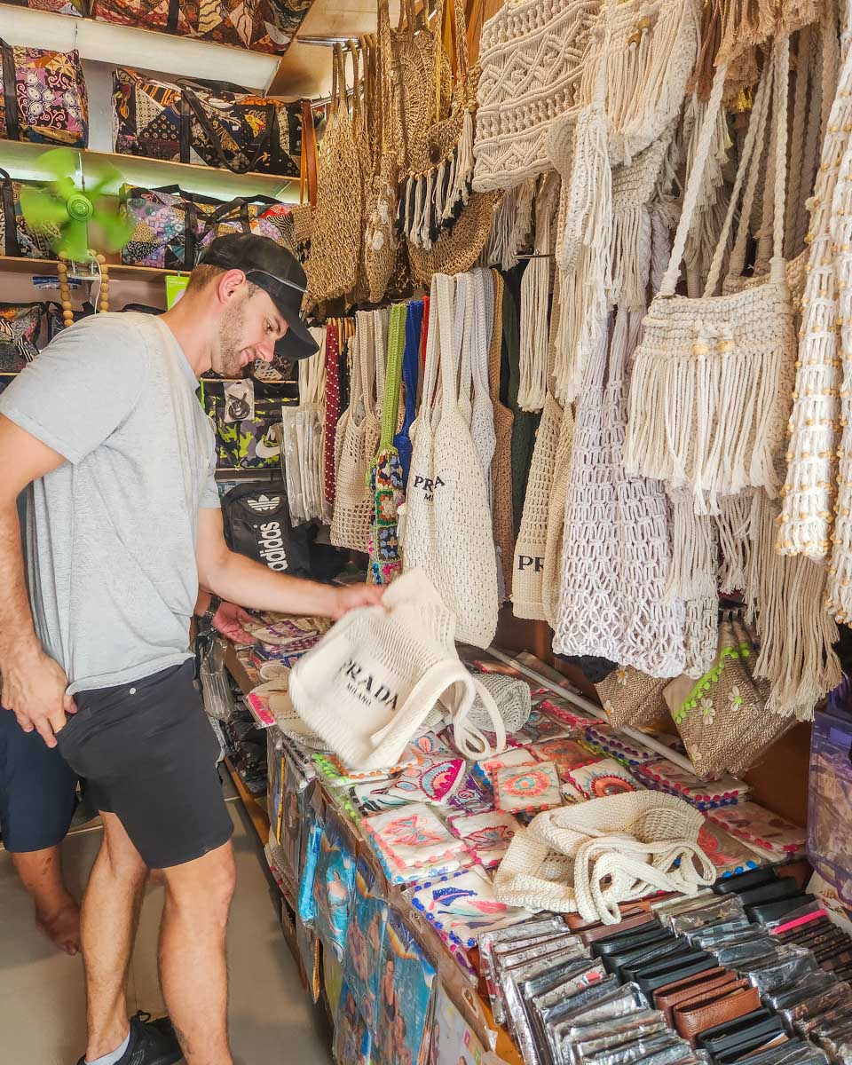 Daniel shops for a fake Prada bag in Bali