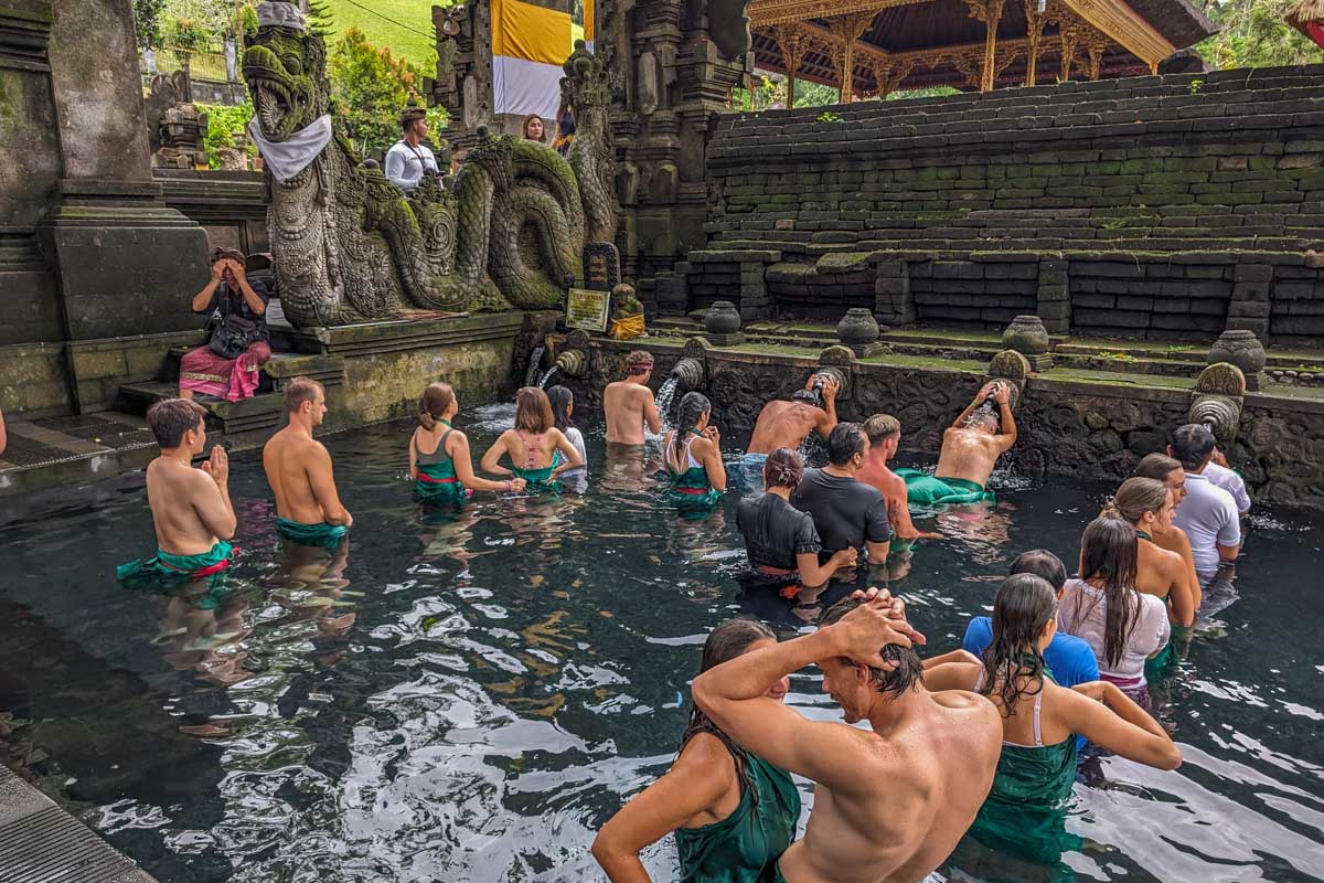 People line up at the Pura Tirta Empul water baths in Bali