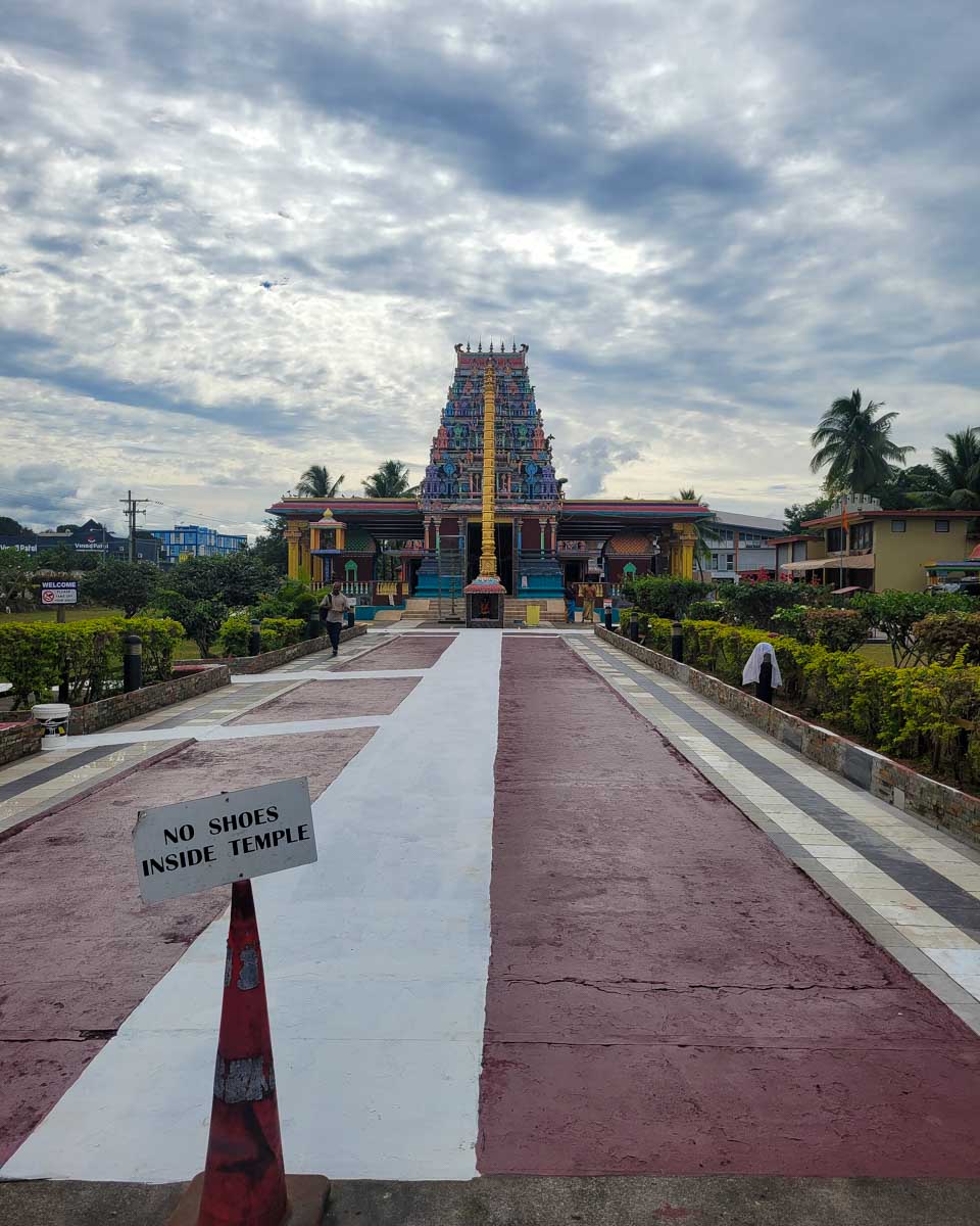 Walking into Hindu temple Sri Subramaniya with a sign that says no shoes inside temple fiji