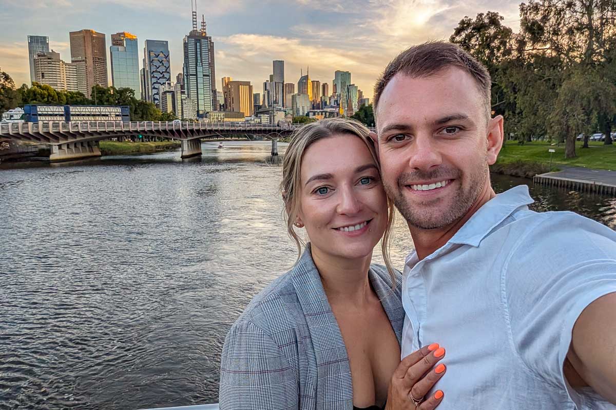 Bailey and daniel smile for a selfie on the deck of the spirit of melbourne dinner cruise