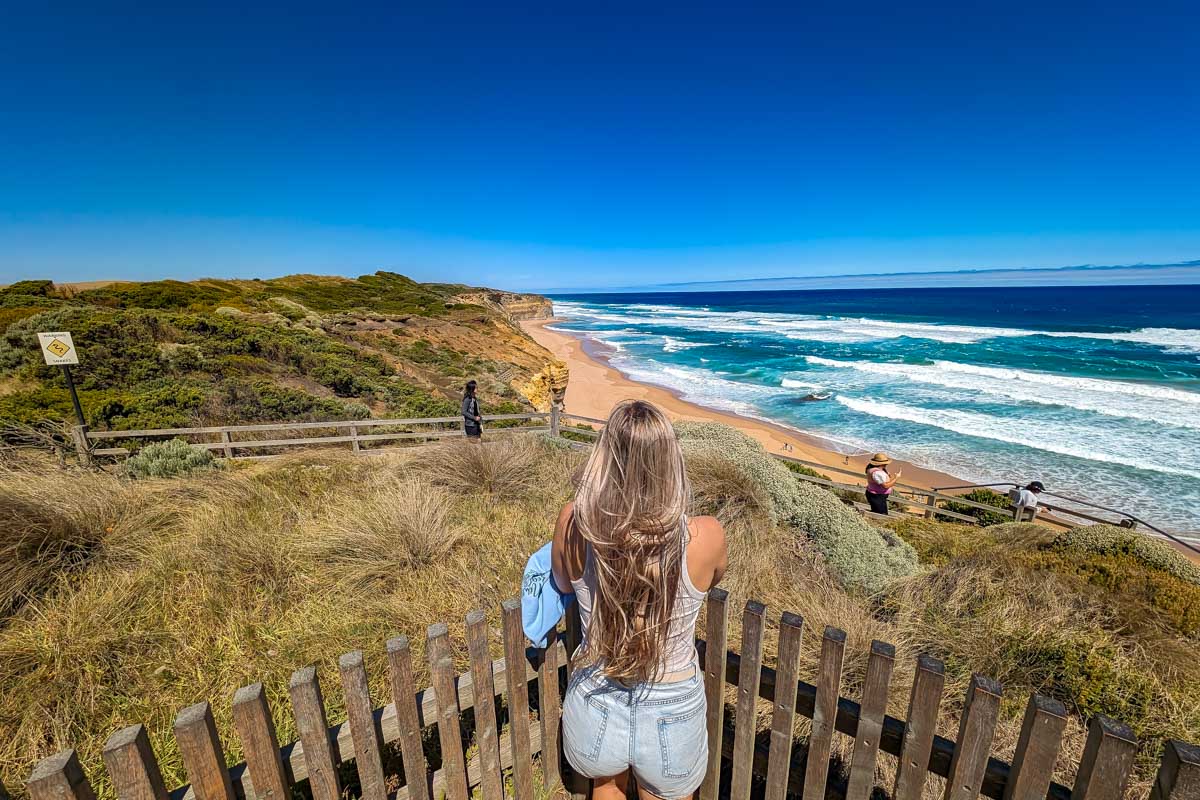 Bailey looking out at the ocean on a great ocean road tour australia