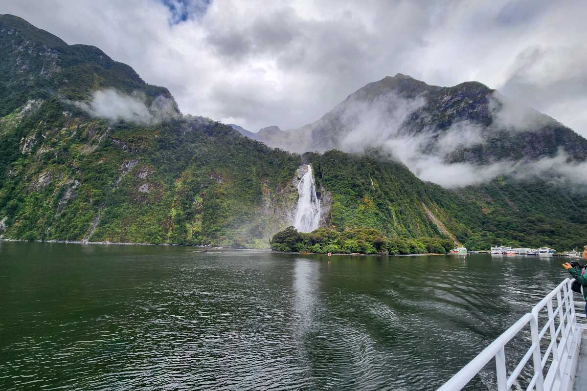 Looking at a waterfall on a Milford Sound Cruise New Zealand
