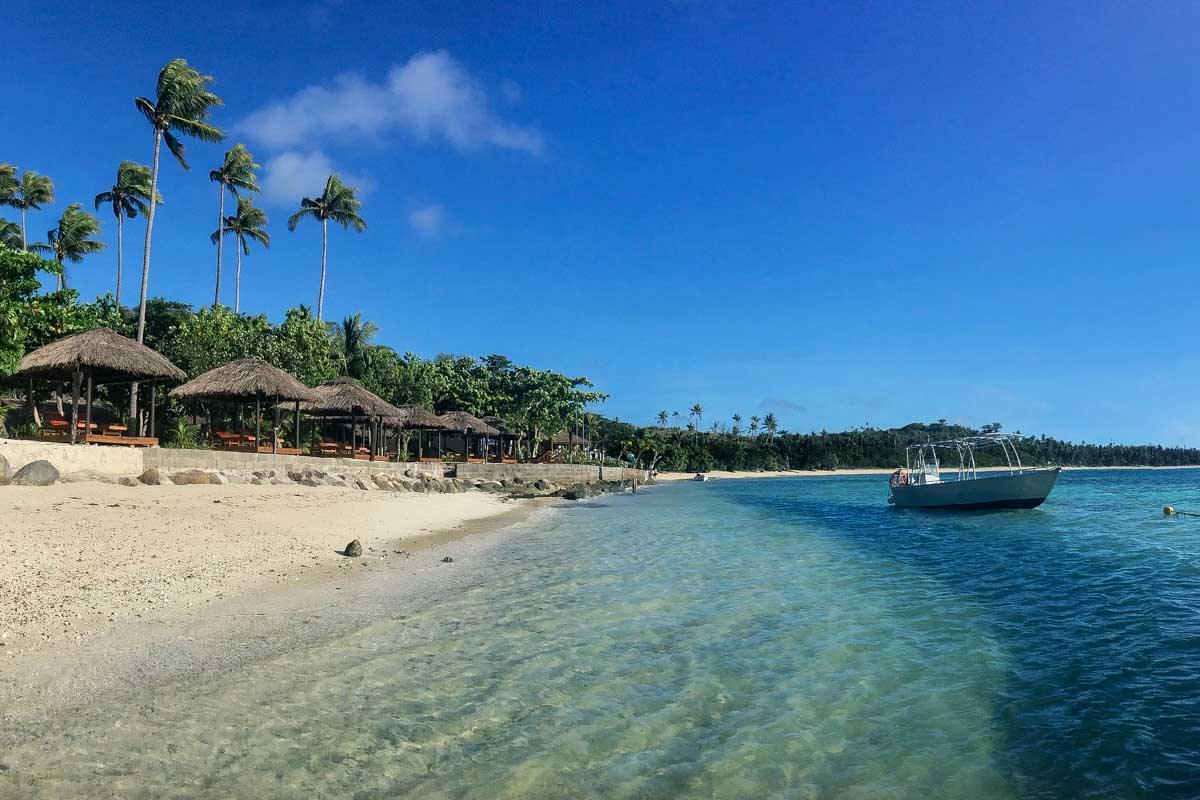 A boat sits at a beach in the Yasawa Islands Fiji