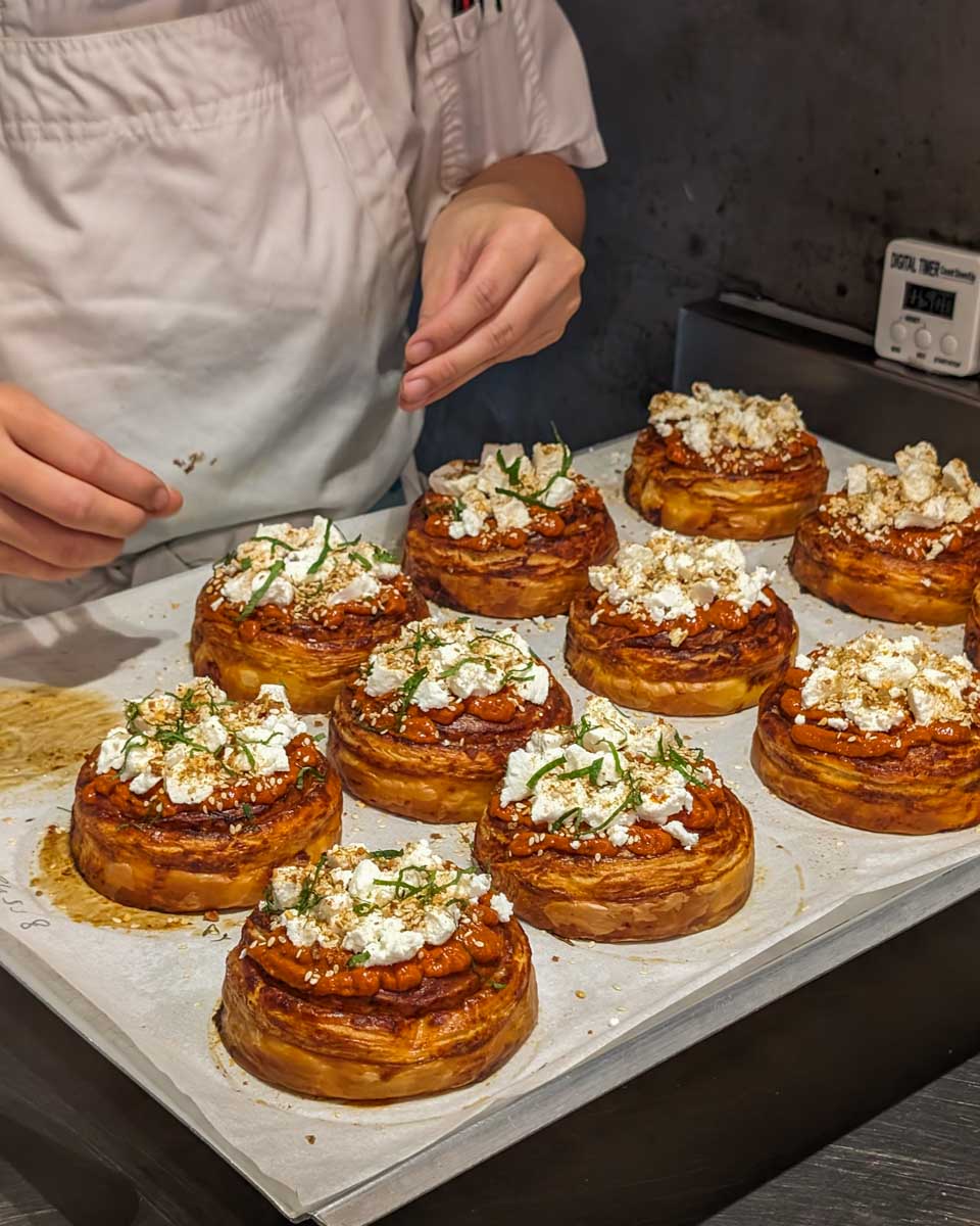 A lady makes croissants at Lune Croissanterie in Melbourne