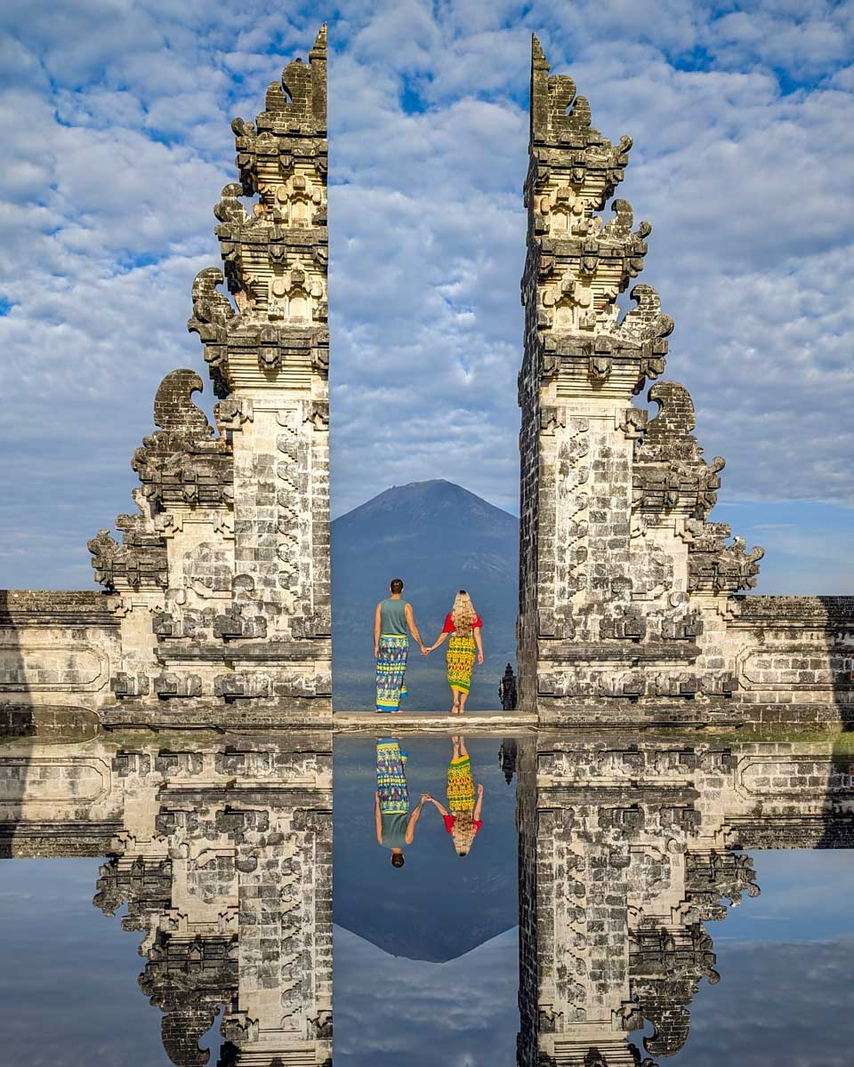 Bailey-and-Daniel-at-the-gate-to-Lempuyang-temple-with-the-mountain-in-the distance on the instagram tour bali through get your guide
