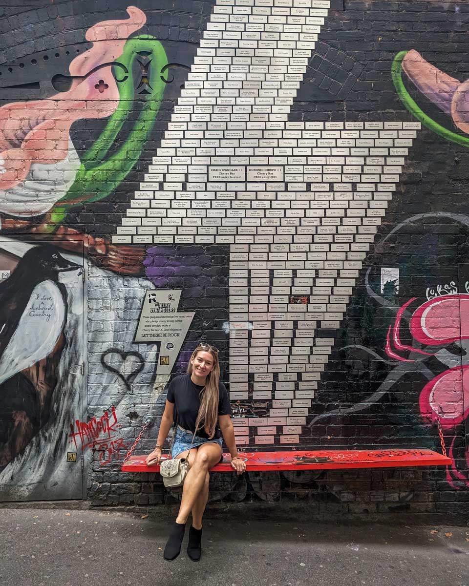 Bailey sits on a bench in ACDC lane in Melbourne