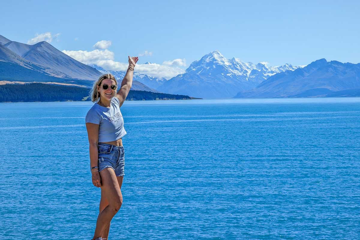 Bailey-stands-overlooking-Mount-Cook-National-Park-from-one-side-of-Lake-Pukaki-New-Zealand