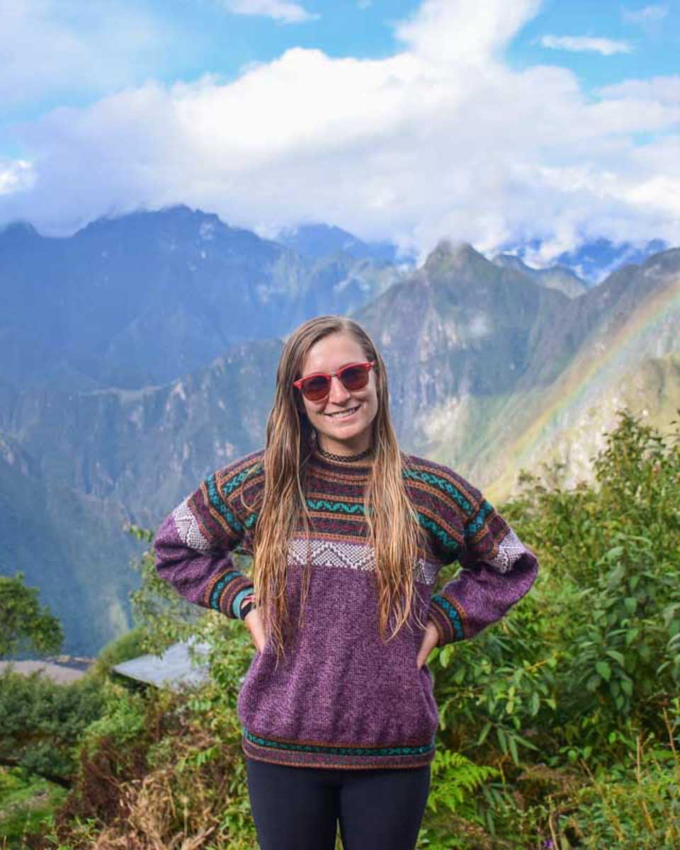Bailey-on-the-Salkantay-Trek-with-views-of-Machu-Picchu-behind-her