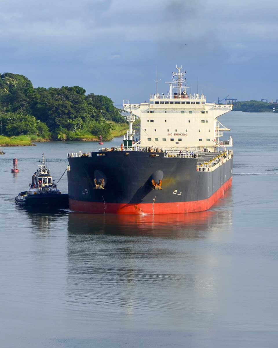 A large cargo ship going down the Panama Canal Panama City Panama