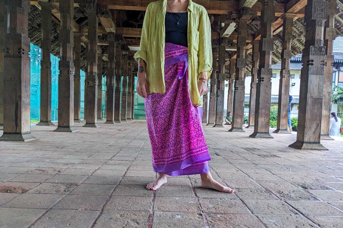 A woman wears a sarong at the Sacred Tooth Temple in Kandy Sri Lanka