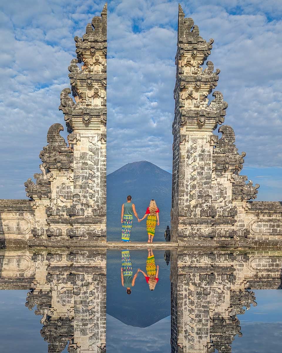 Bailey and Daniel stand at the gate to heaven at Lempuyang Temple Bali