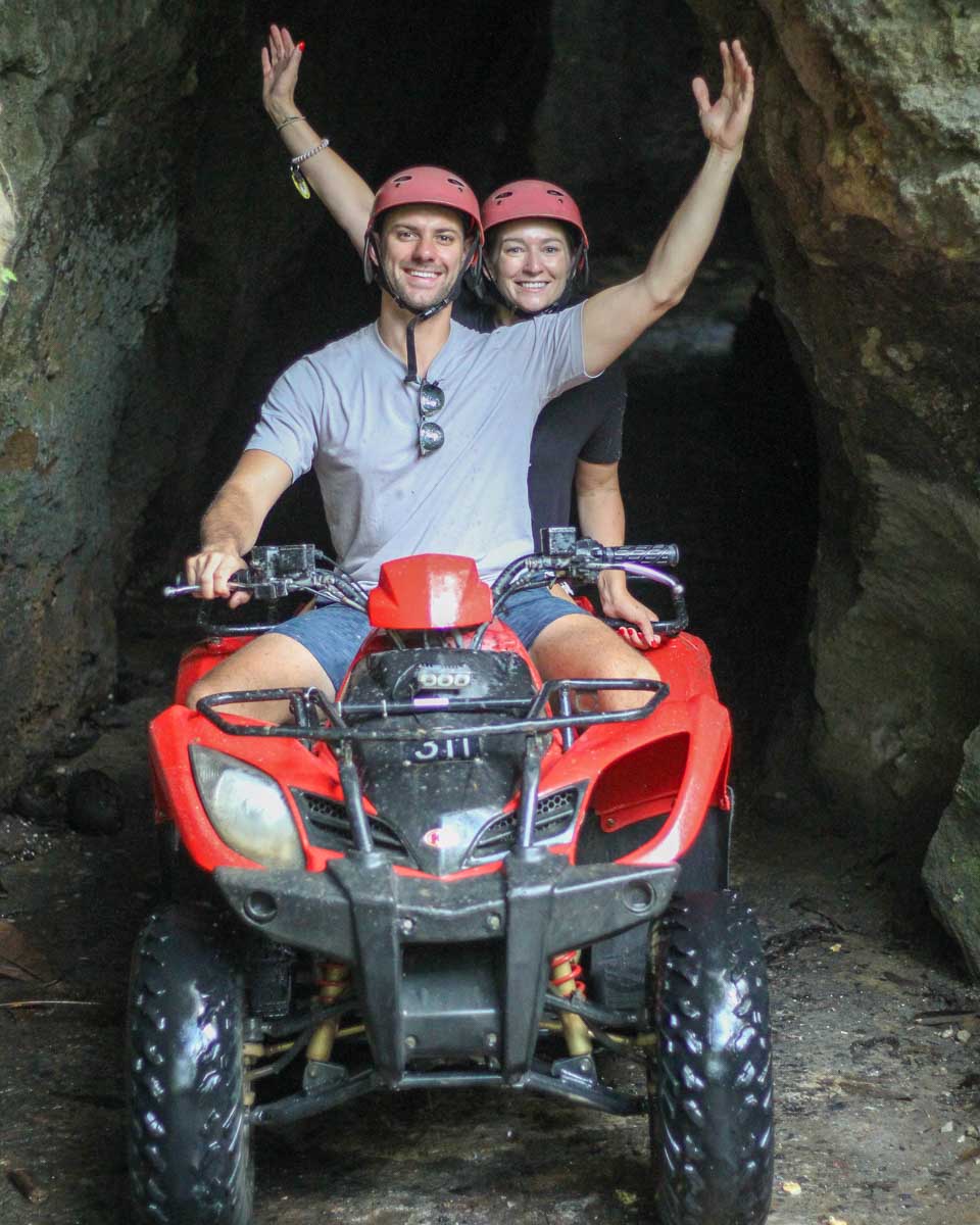 Daniel and Bailey coming out of a cave on an ATV tour in Bali