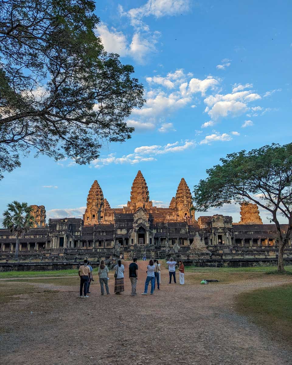 Group of people at Angkor Wat Temple seen from the back just after sunrise Siem Reap Cambodia