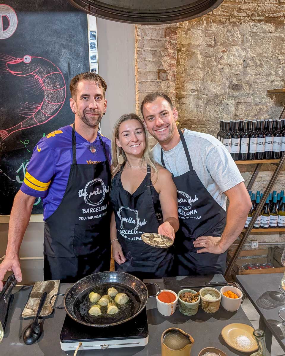 Bailey, Daniel and friend smile during a Paella making class in Barcelona Spain