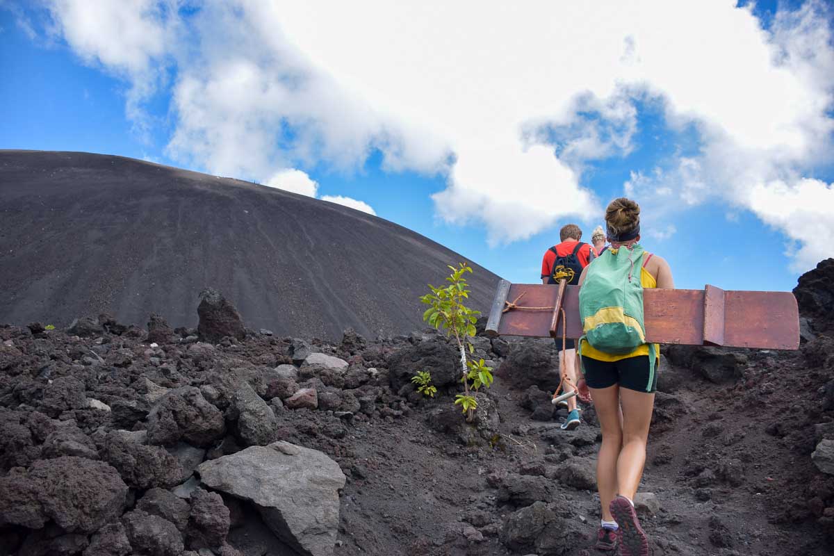Bailey and others climbing Cerro Negro to volcano board in Nicaragua