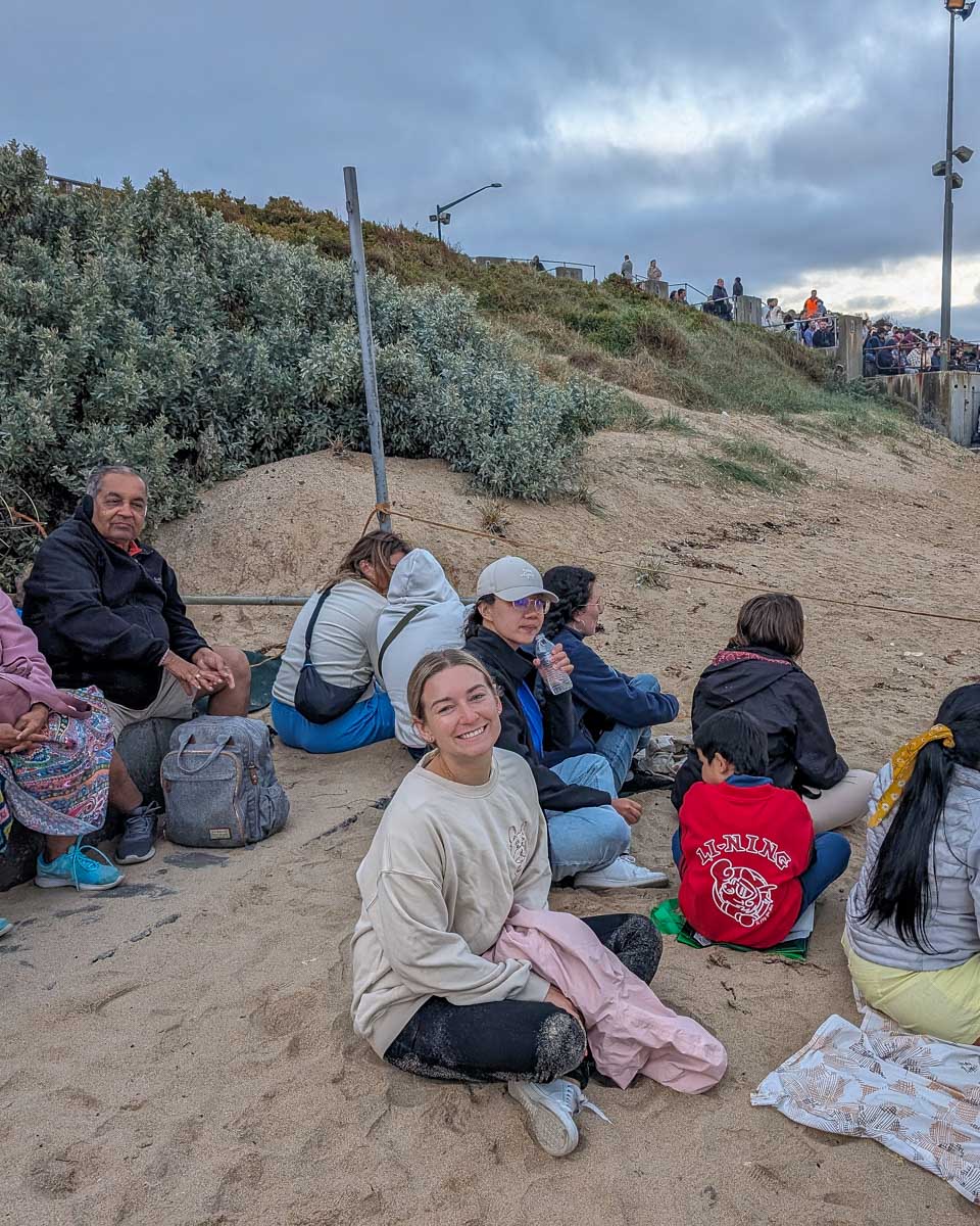 Bailey smiles on the beach waiting for fairy penguins on Phillip Island Australia