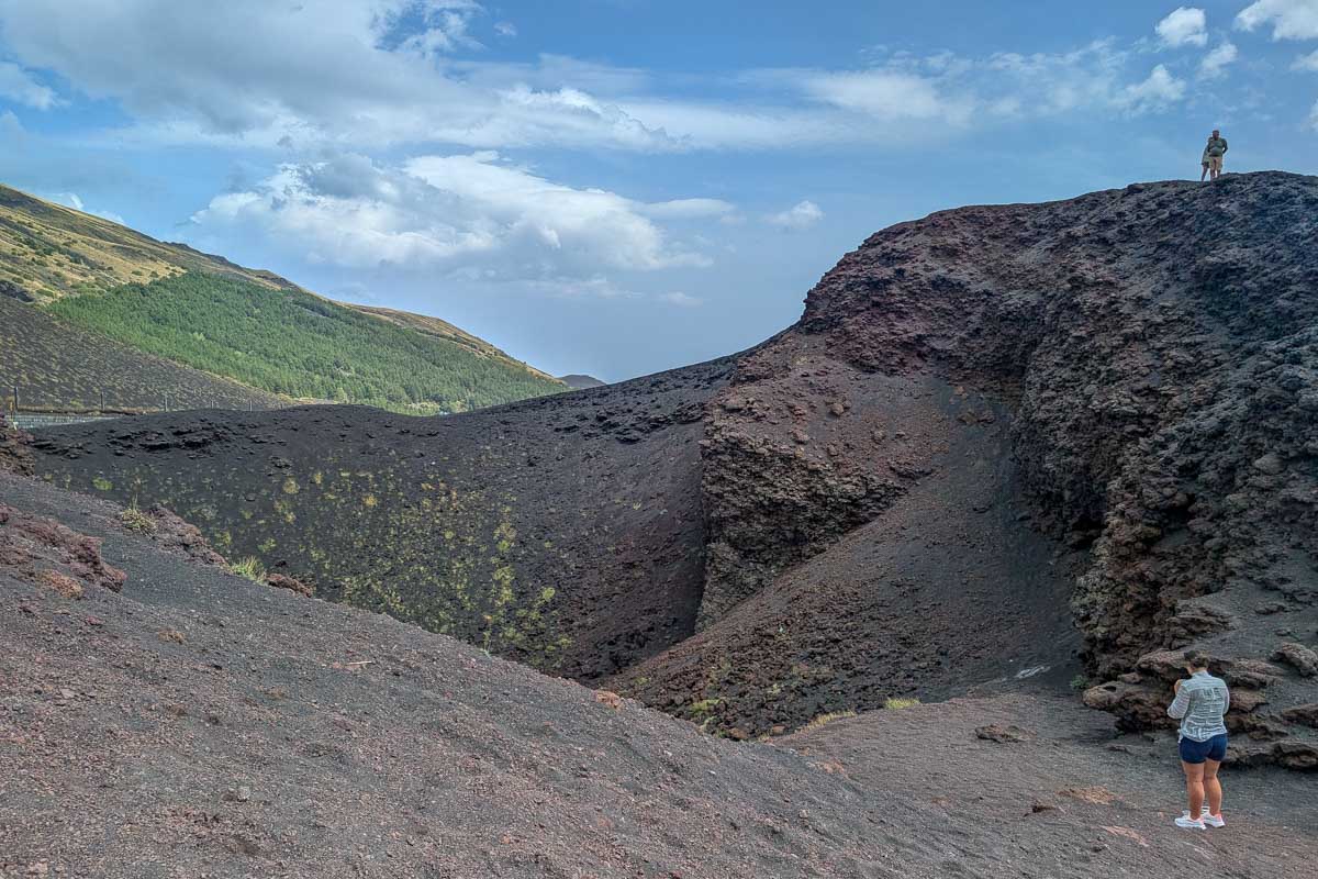 People stand and admire Mt Etna on a tour to Mt Etna from Catania Italy