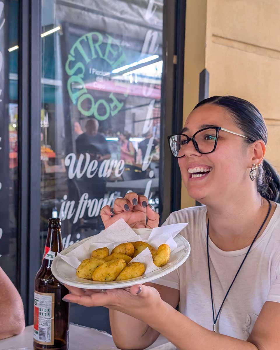 A-person-holding-a-plate-of-food-on-a-food-tour-in-Venice-Italy