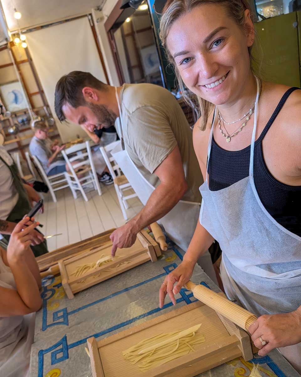 Bailey makes noodles during a cooking class in Rome Italy