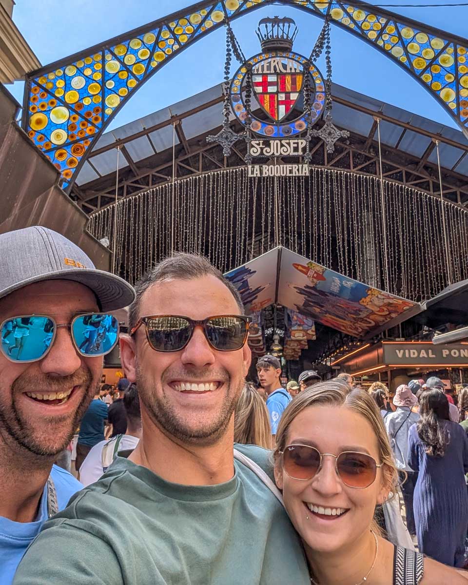 Daniel and Bailey and friend take a selfie out front of La Boqueria market in Barcelona Spain