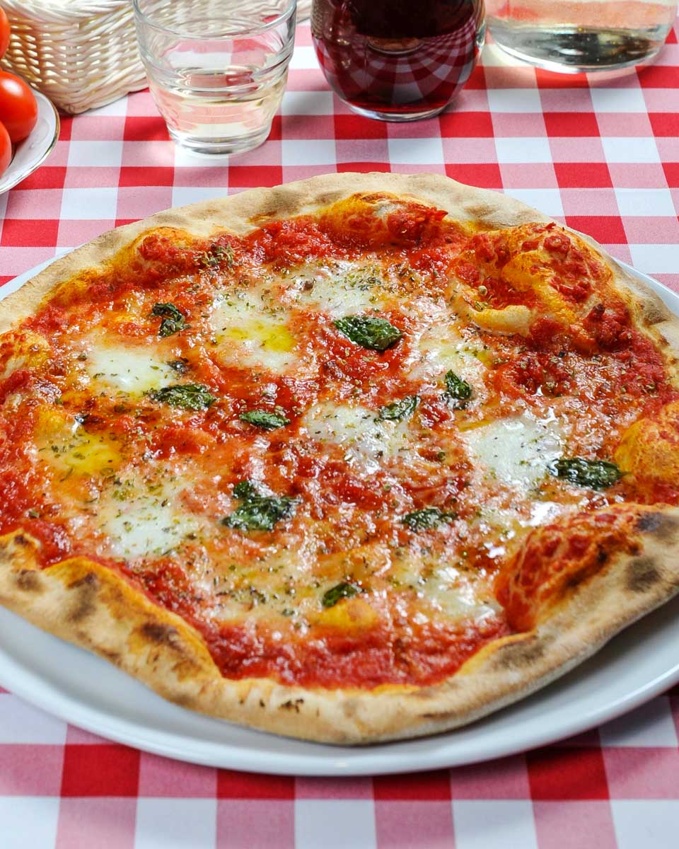 Pizza made during a pizza making class in Naples Italy