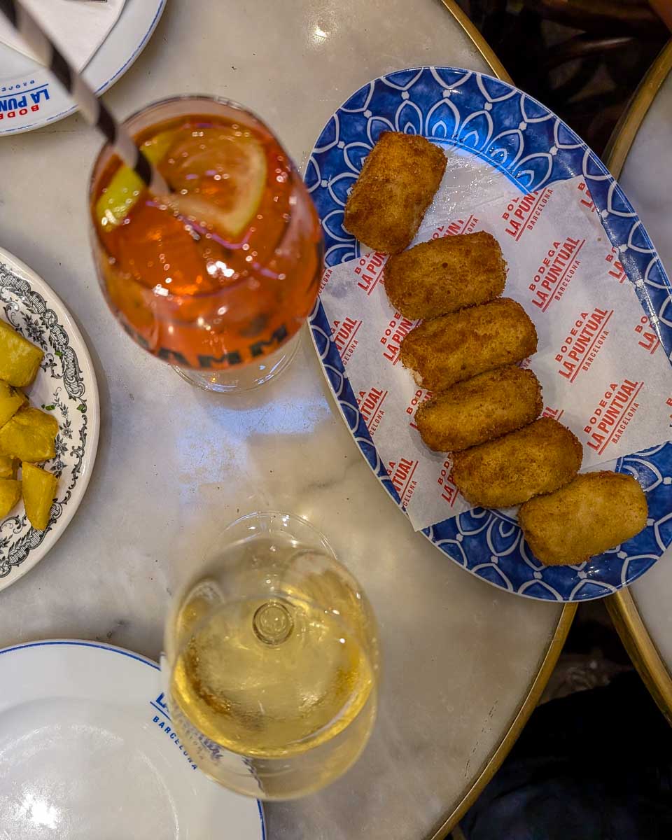 Tapas and wine on a table on a tour in Barcelona Spain