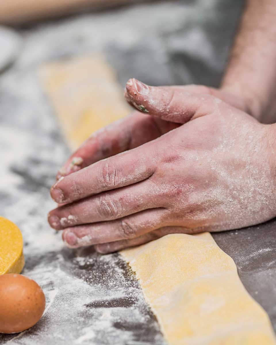 A person making pasta during a cooking class in Florence Italy