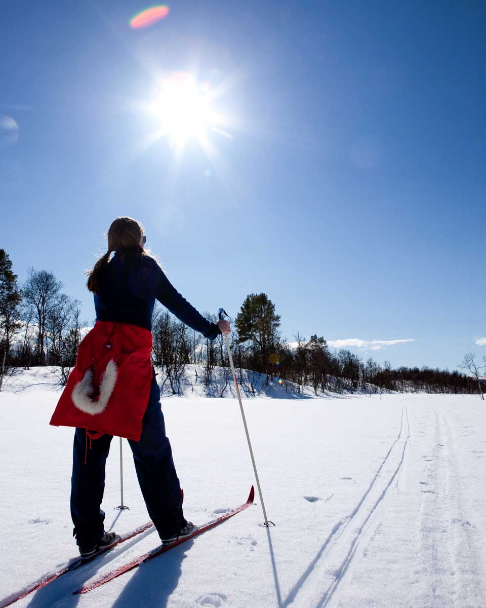 A woman cross country skis in Tromso Norway