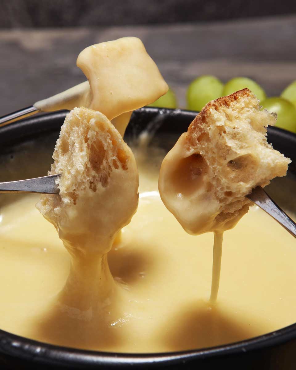 Fondue being eaten on a tour in Zurich Switzerland