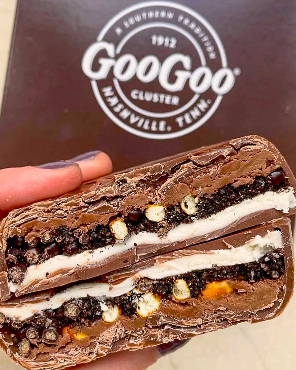 Goo Goo Clusters a person holds a goo goo cluster in Nashville Tennessee