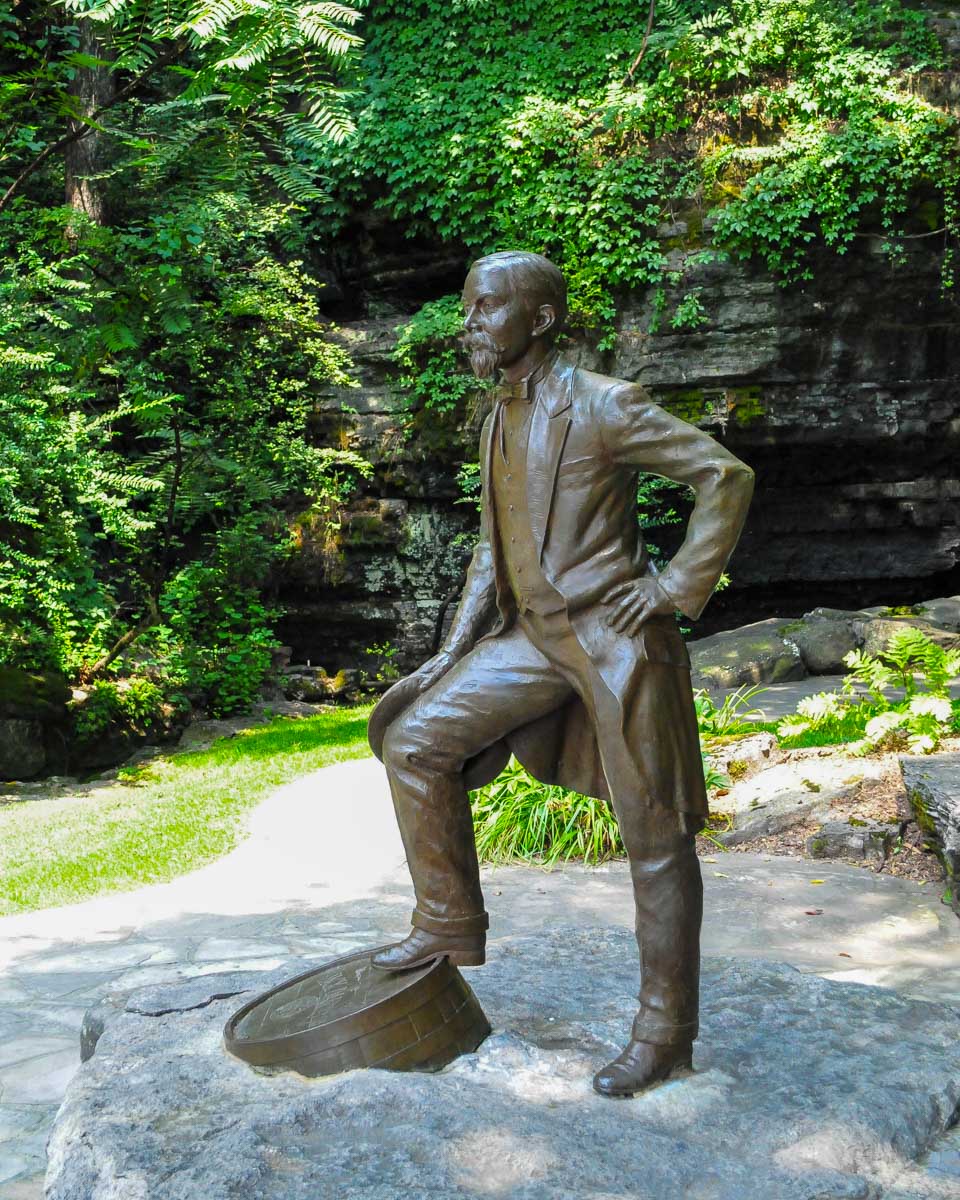 Jack Daniels statue at the distillery on a tour from Nashville Tennessee United States
