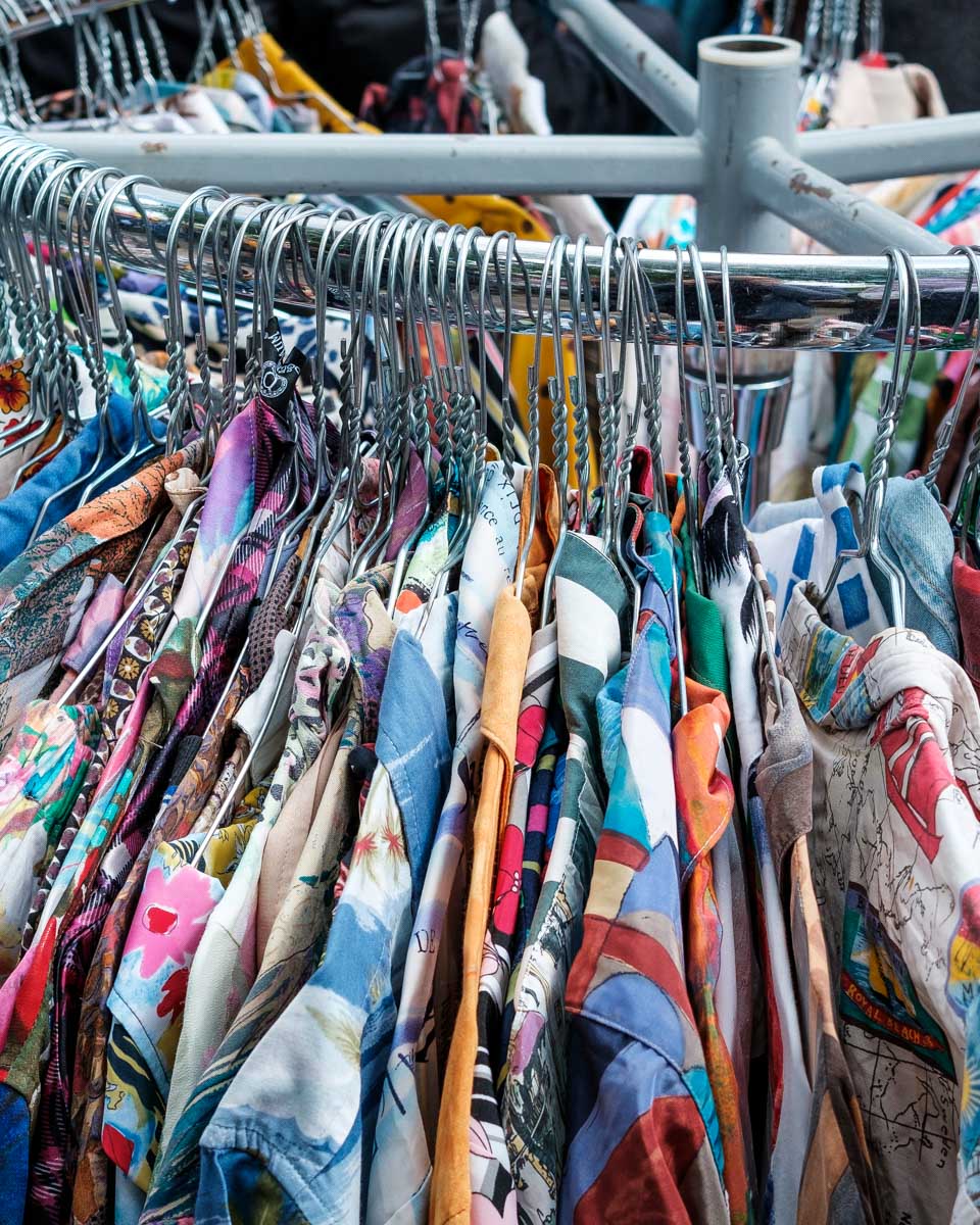 Vintage clothes being sold at the Albert Cuyp Market in Amsterdam Netherlands