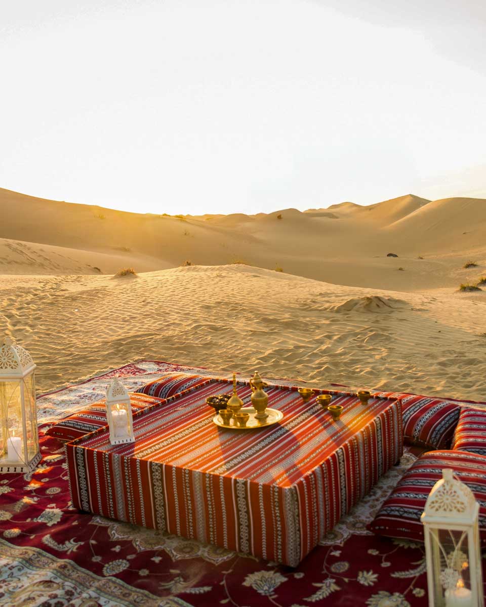 A dinner setup in the desert on a tour from Abu Dhabi