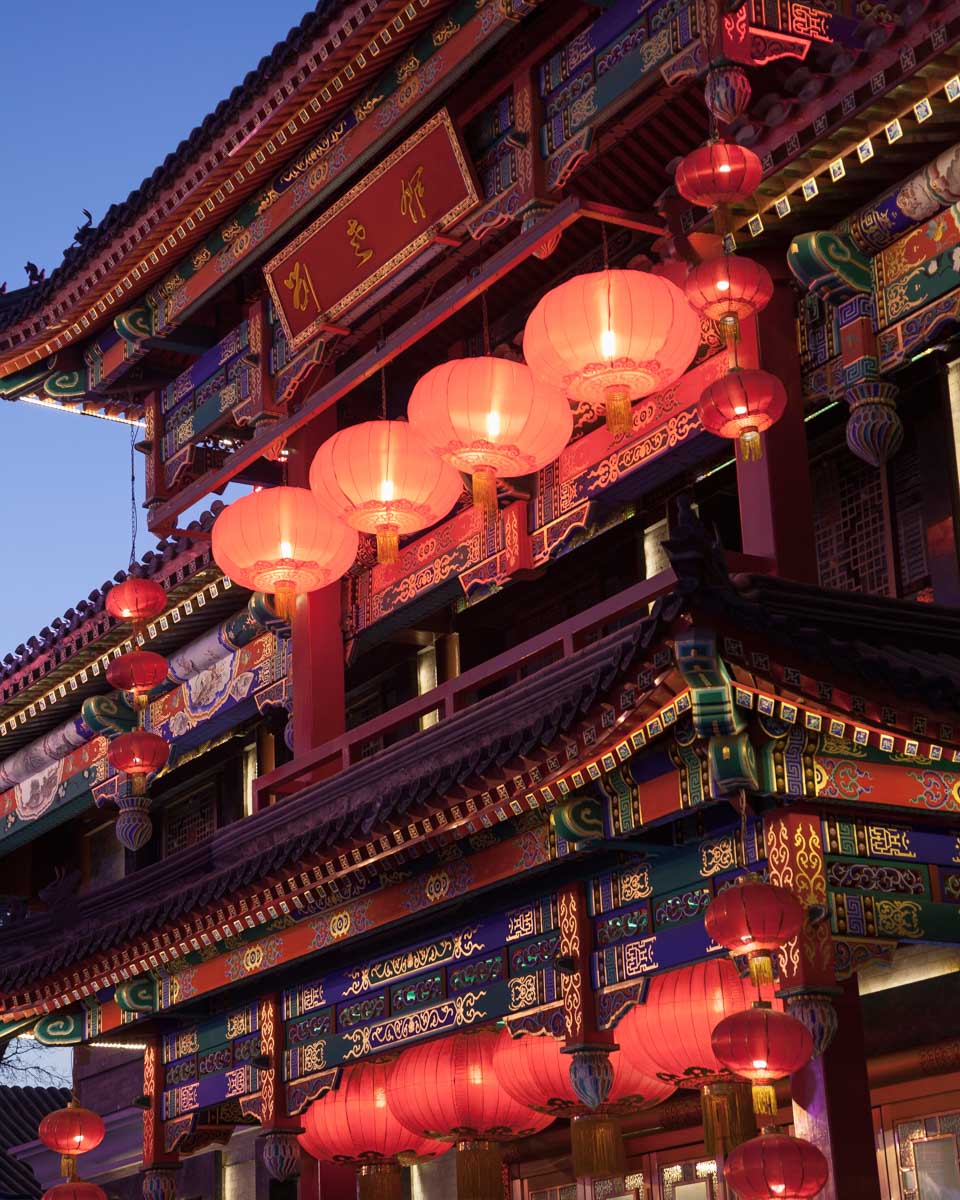 A traditiona house with lanterns seen at night on a tour in Beijing China