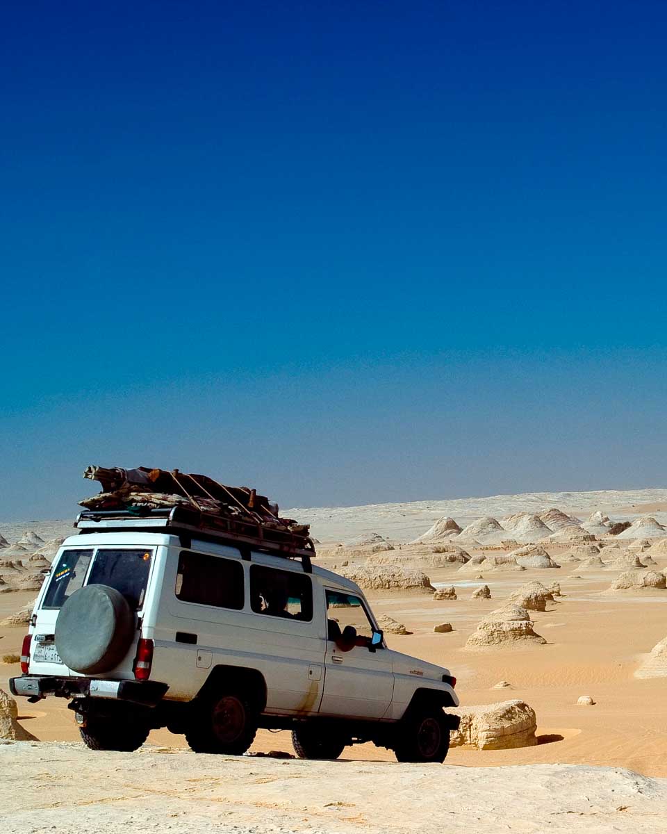 A vehicle in the white desert on a camping trip from Cairo Egypt