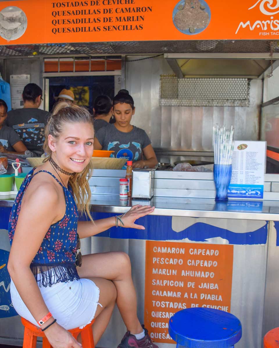 Bailey-sits-at-a-taco-stand-in-Mexico City Mexico