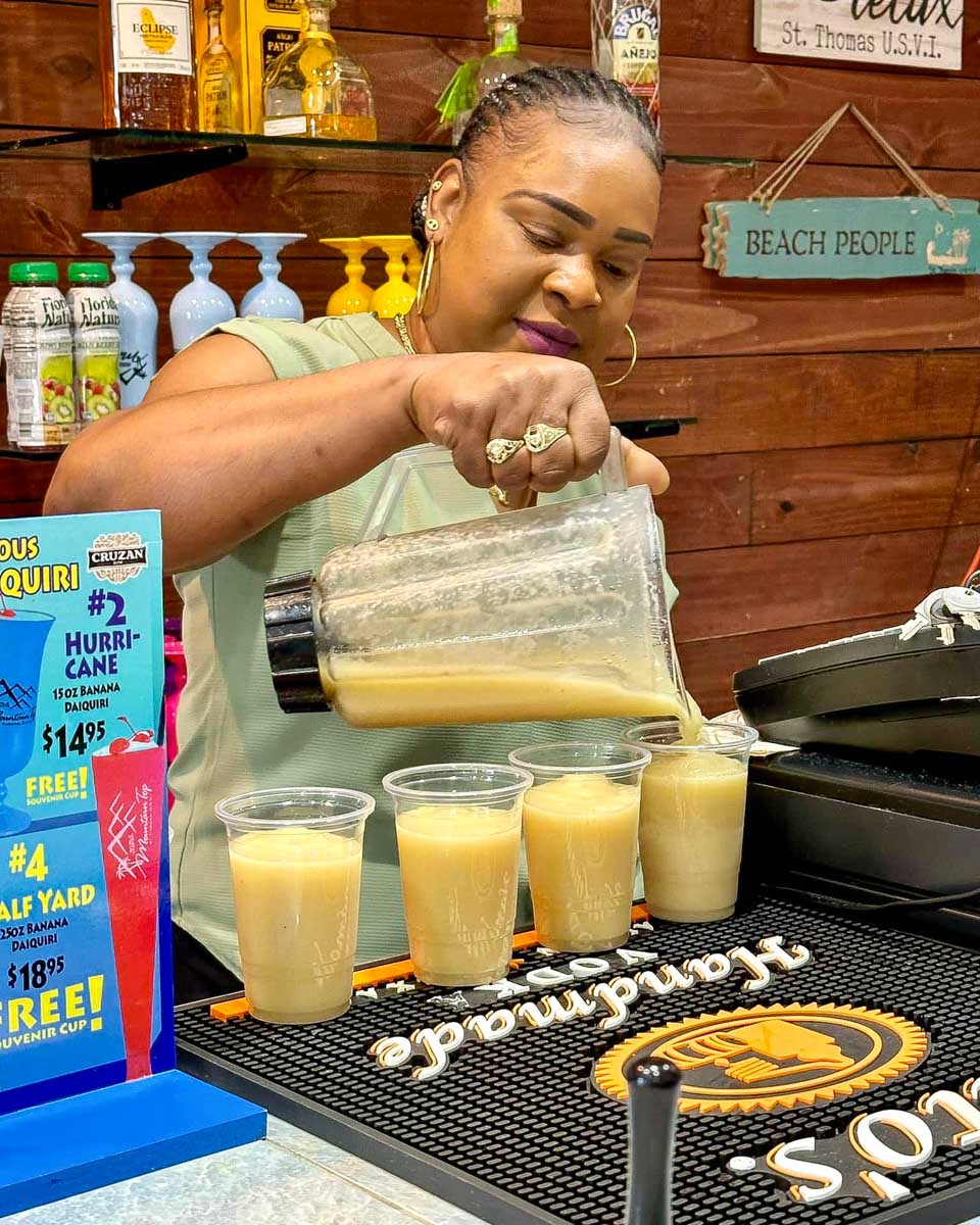 Flavors Food Tours woman makes drinks on a food tour in St Thomas Virgin Islands