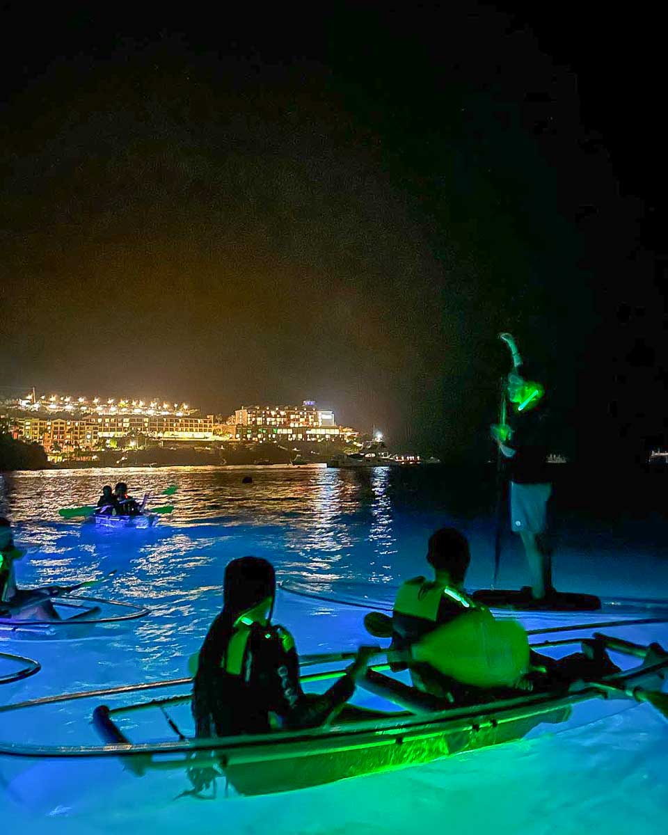 Night Kayak a guide talks to people in kayaks on a tour in San Juan Puerto Rico
