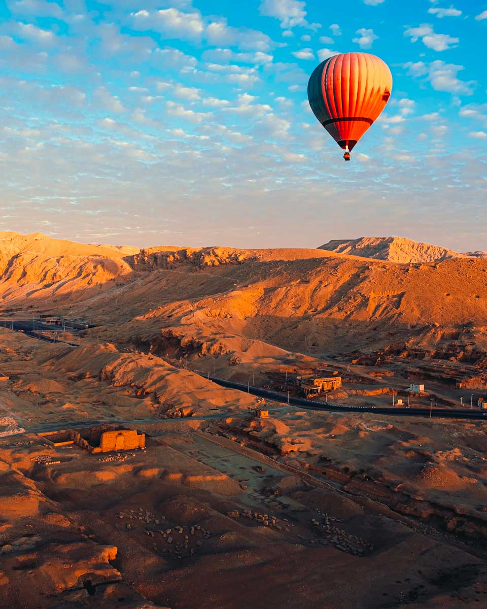 A-hot-air-balloon-flies-at-sunrise-in-Luxor-on-a-cruise-to-Luxor-Egypt from Aswan