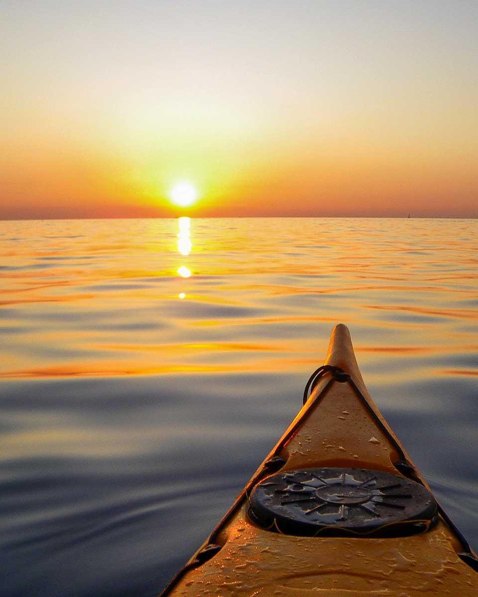 A kayak in the sea at sunset on a tour from Dubrovnik Croatia