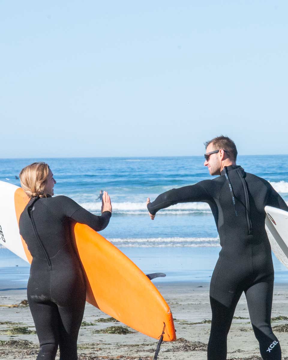 Daniel-and-Bailey-high-five-before-going-out-for-a-surf-Kauai-Hawaii